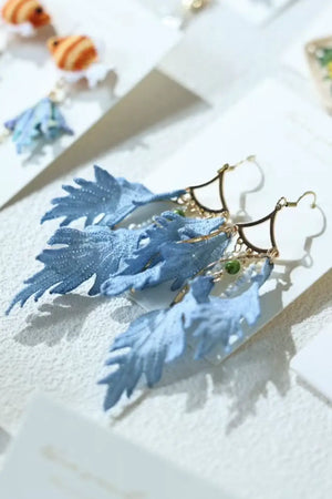 blue feather earrings