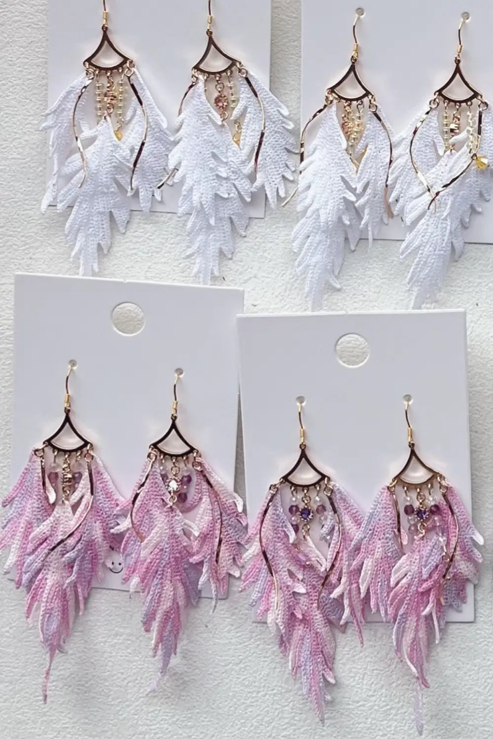 white and pink feather earrings