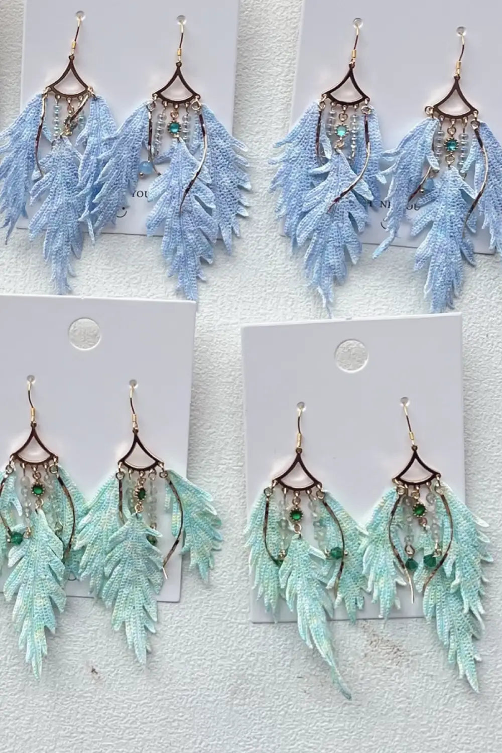 blue and green feather earrings