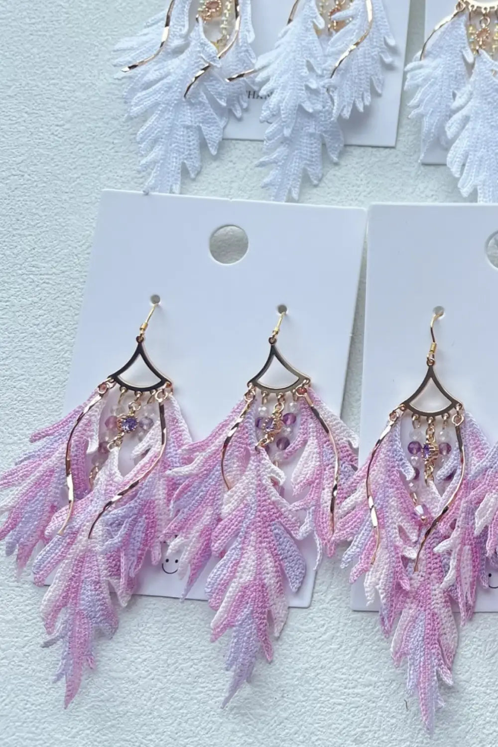 pink feather earrings